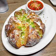 Bacchanalia signature dishes Chicken VesuvioEggplant ParmesanGarlic Bread